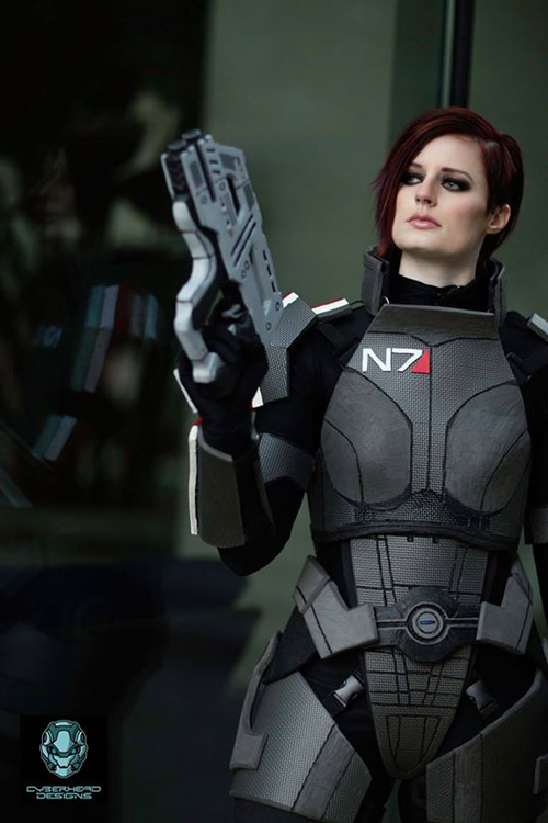 Photographer. looks badass in her awesome Commander Shepard from Mass Effec...