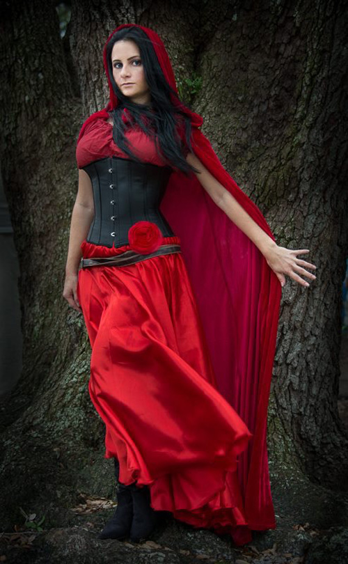 Photographer. looks beautiful as fairy tale Red Riding Hood all grown up. 